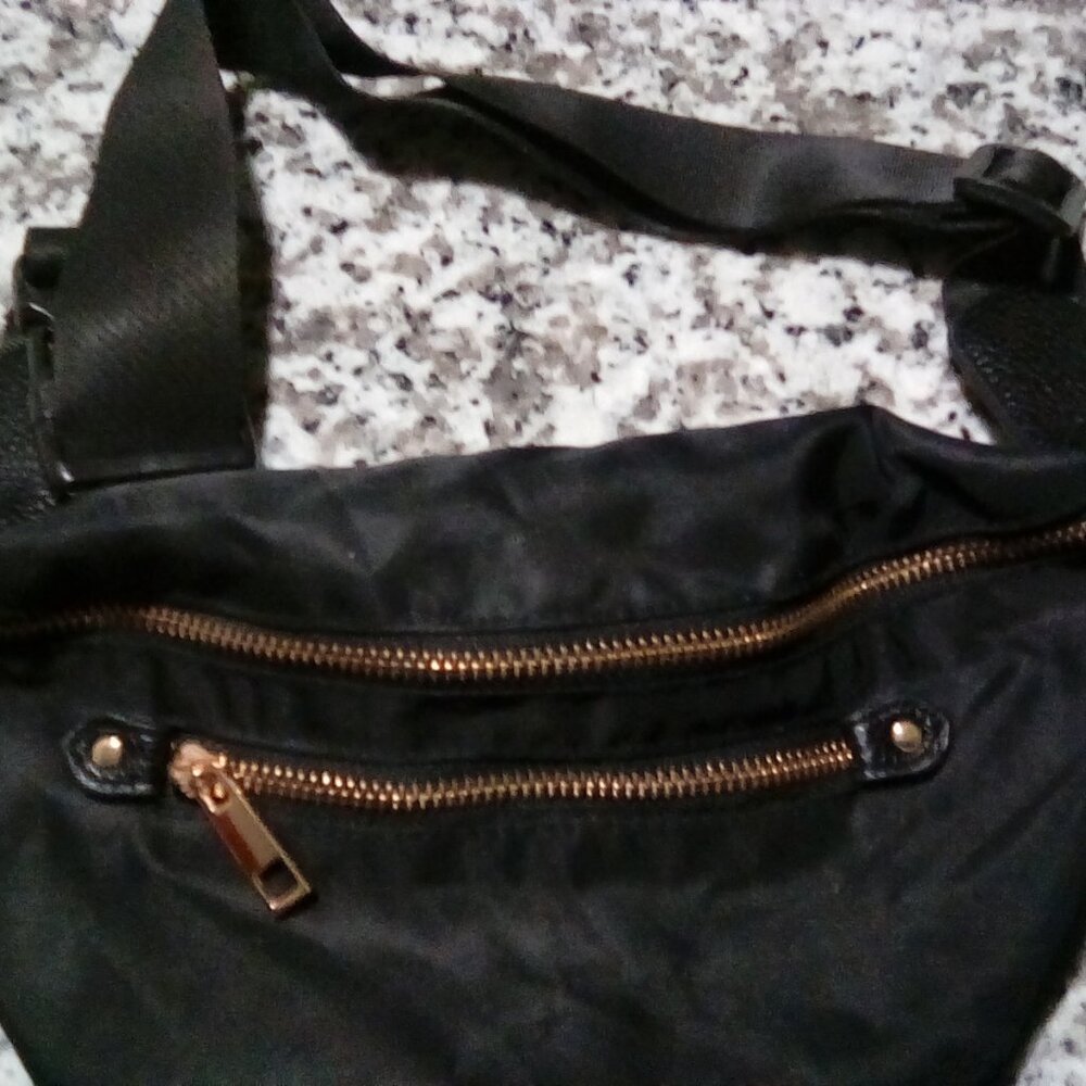 a . New day black Fanny Pack
